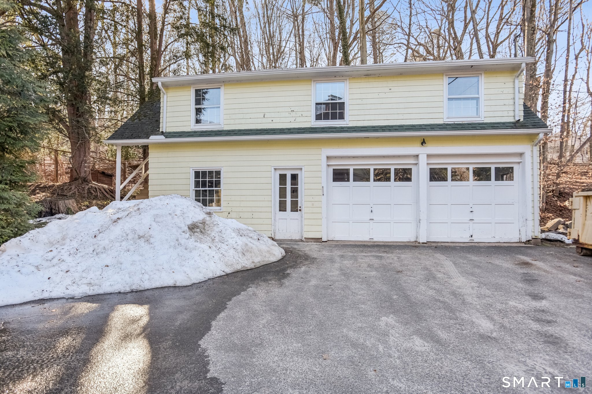 1050 Whitney Avenue Hamden, CT 06517 - Photo 38 of 40 front view of a house with a dry yard