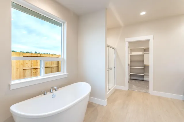 a bathroom with a bathtub and a sink