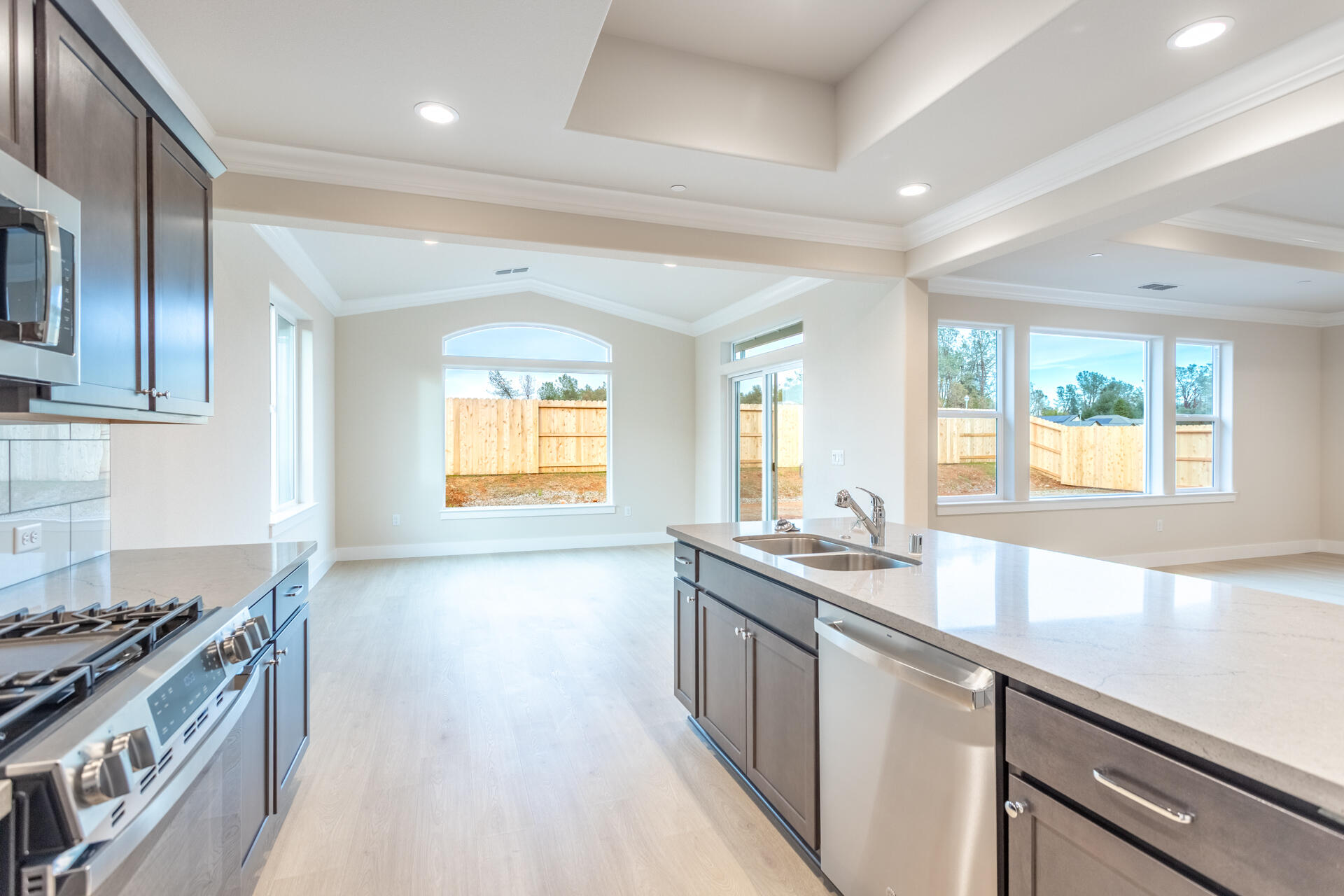 3258 Lower Lane Redding, CA 96002 - Photo 7 of 27 a kitchen with stainless steel appliances granite countertop a sink and a stove