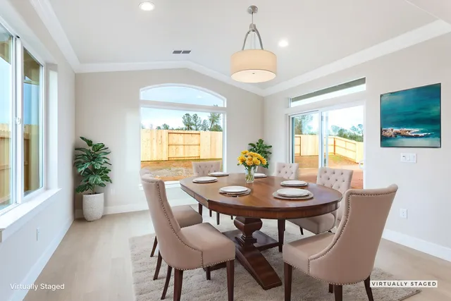 a view of a dining room with furniture and window