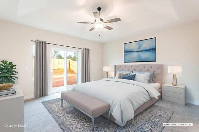 a bedroom with a large bed and a window