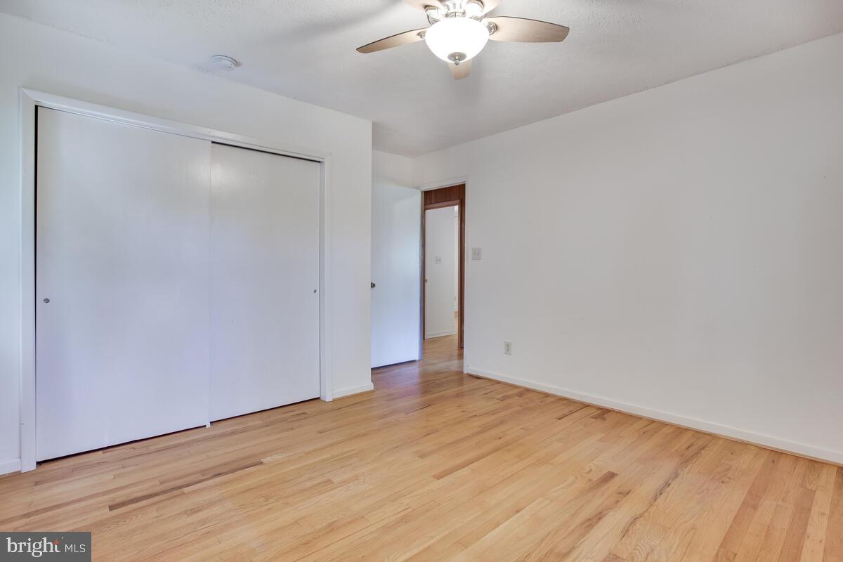2645 Aspen Road Port Republic, MD 20676 - Photo 27 of 51 a view of an empty room with wooden floor