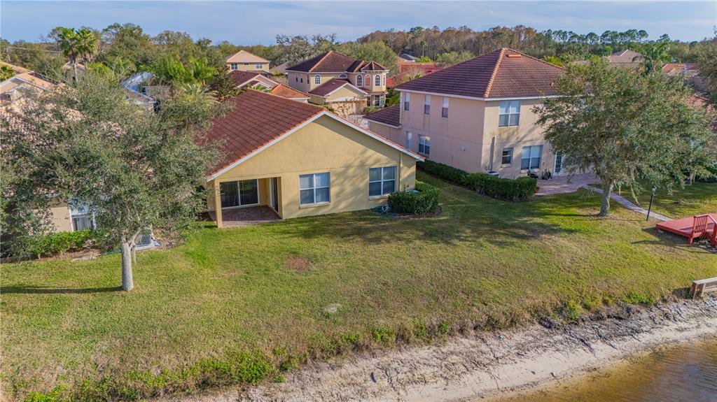 18028 Java Isle Drive Tampa, FL 33647 - Photo 13 of 53 front view of a house with a yard
