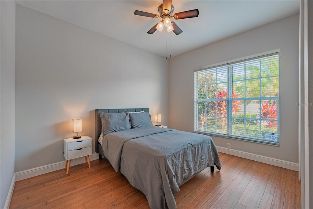 18028 Java Isle Drive Tampa, FL 33647 - Photo 18 of 53 a bedroom with a bed and a window