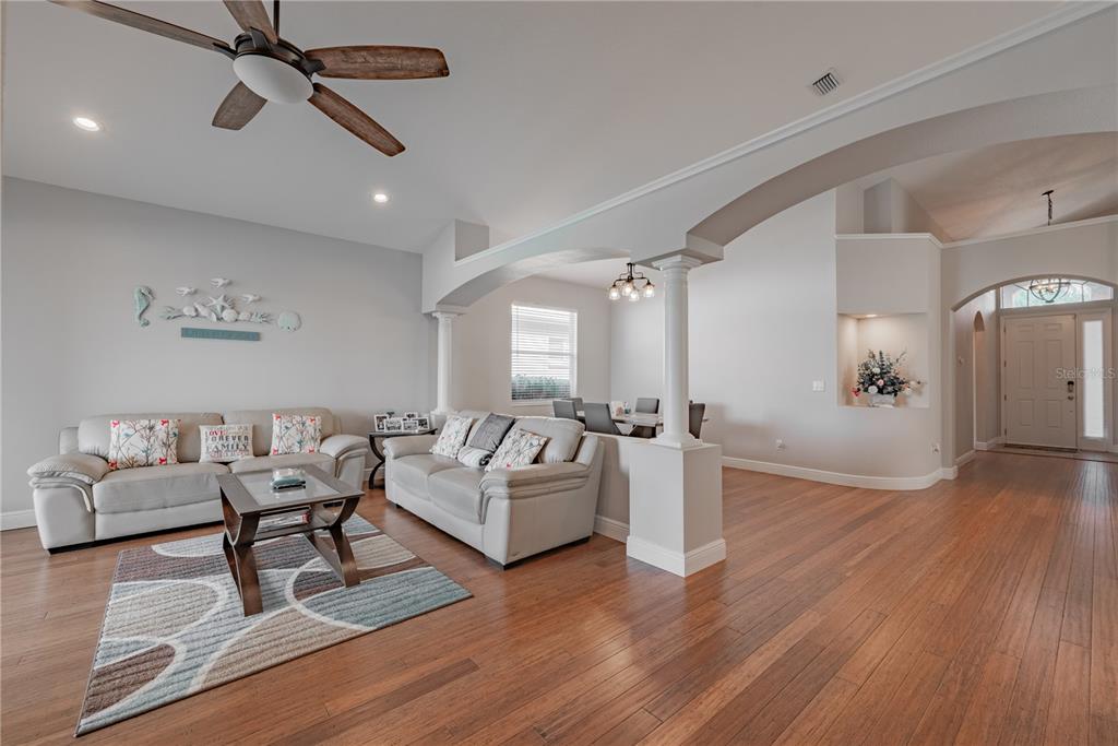18028 Java Isle Drive Tampa, FL 33647 - Photo 31 of 53 a living room with furniture and a wooden floor