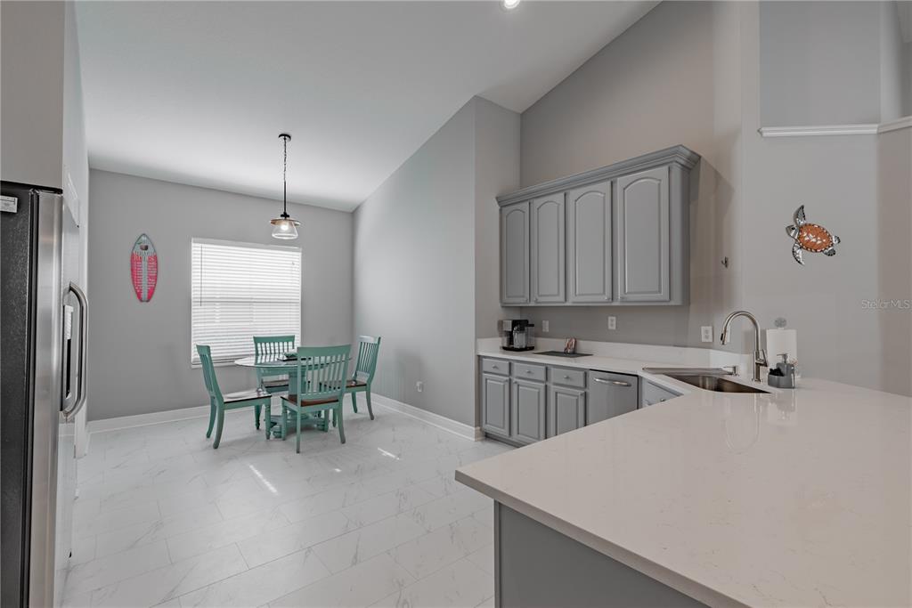 18028 Java Isle Drive Tampa, FL 33647 - Photo 35 of 53 a kitchen with a sink cabinets and window