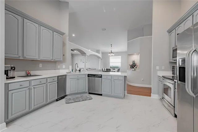 an aerial view of a house with yard swimming pool and outdoor seating