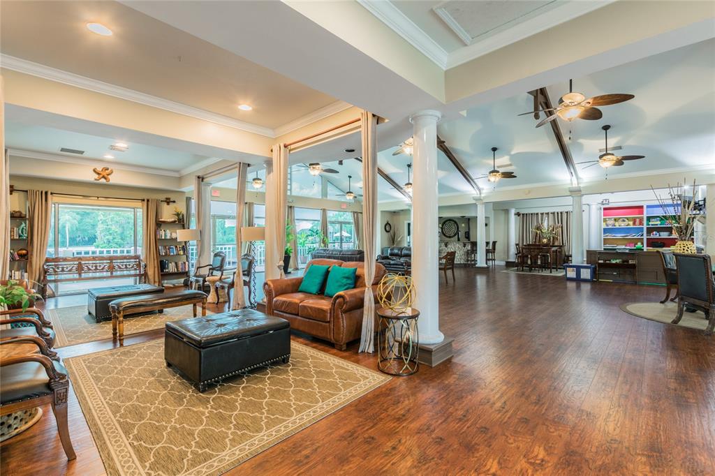 18028 Java Isle Drive Tampa, FL 33647 - Photo 52 of 53 a living room with furniture and a wooden floor