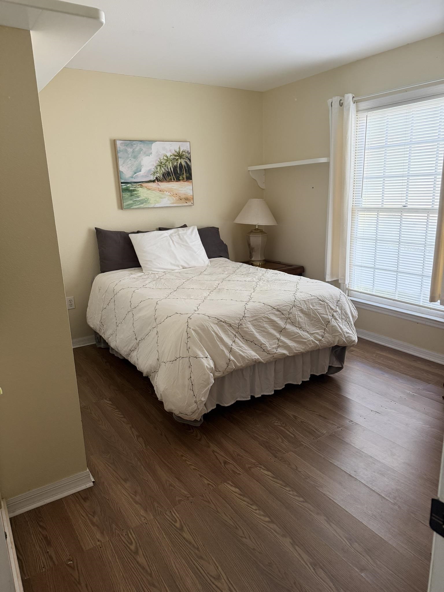 404 Fifteenth Street St. Augustine, FL 32084 - Photo 10 of 23 a bedroom with a bed and window