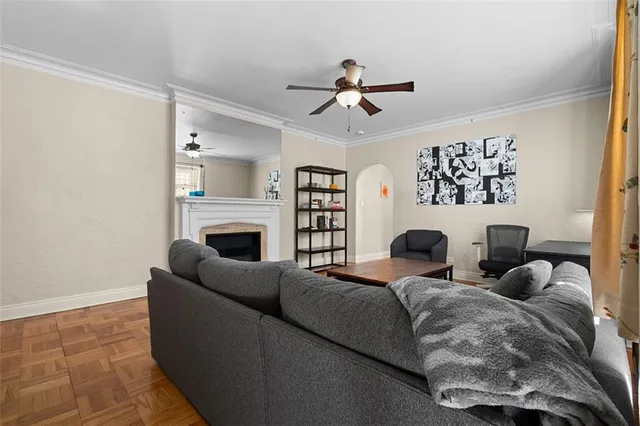 a living room with a couch and a fireplace