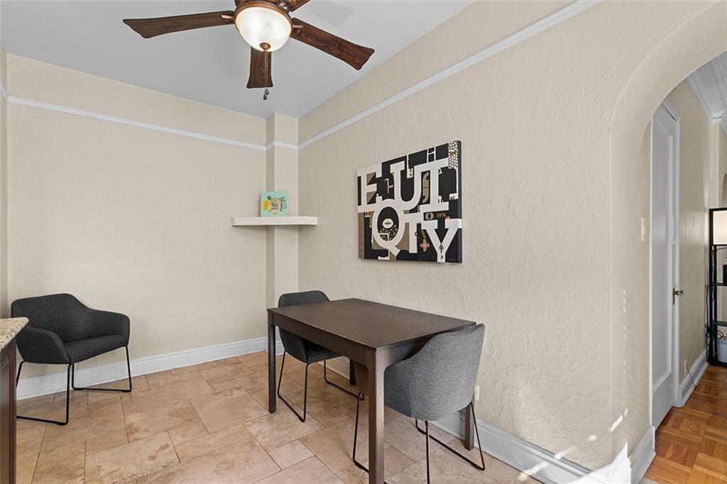 166 North Dithridge Street, Unit 1E Pittsburgh, PA 15213 - Photo 15 of 31 a workspace room with furniture and a chandelier