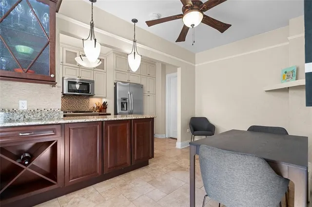 a kitchen with a sink cabinets and appliances