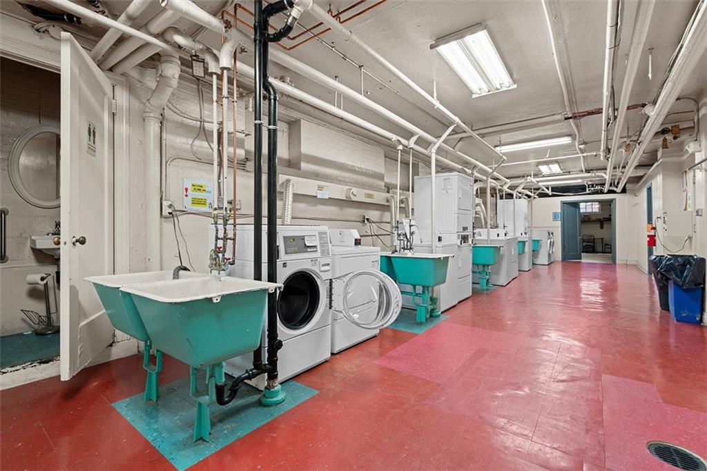 166 North Dithridge Street, Unit 1E Pittsburgh, PA 15213 - Photo 27 of 31 a view of a kitchen with a dining table and chairs