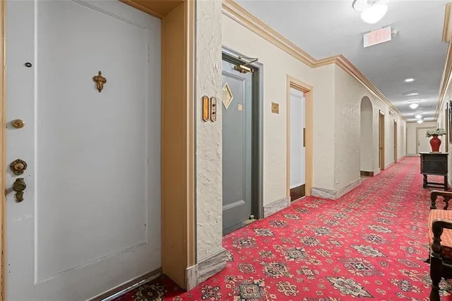 a bedroom with a bed and a mirror