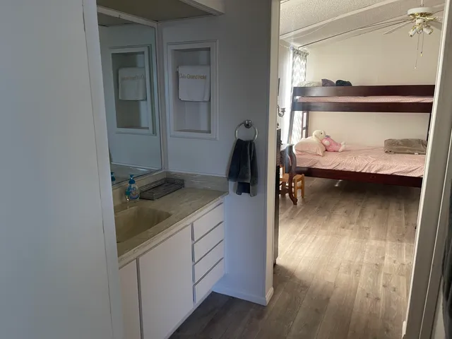 a view of bedroom with wooden floor