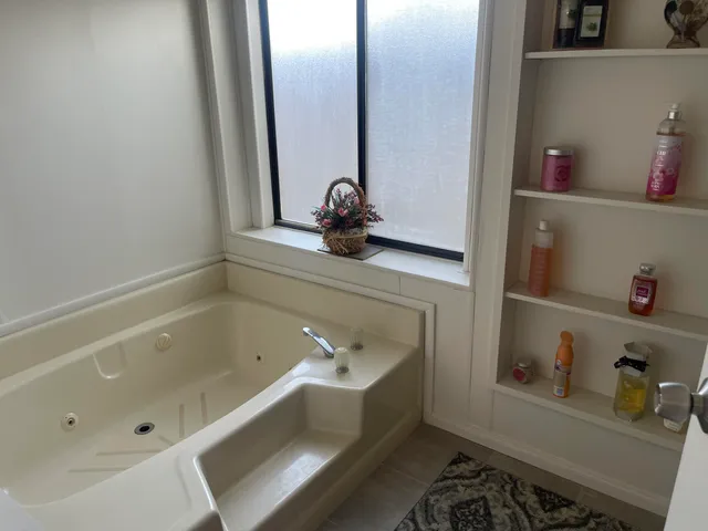 a bathroom with a tub and sink