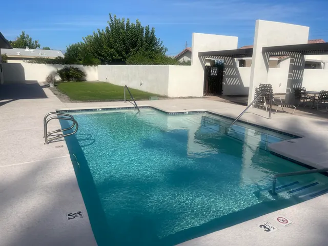 swimming pool view with a outdoor seating