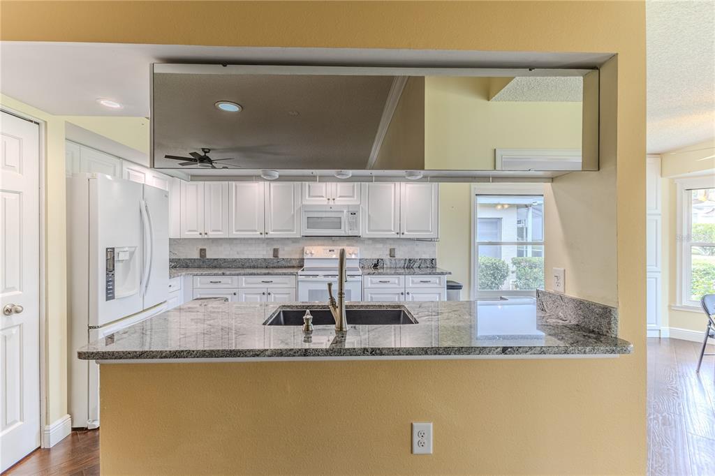 2181 Terrace View Lane Spring Hill, FL 34606 - Photo 16 of 60 a kitchen with counter top space and stainless steel appliances