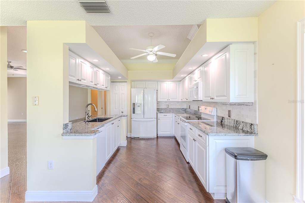 2181 Terrace View Lane Spring Hill, FL 34606 - Photo 20 of 60 a large kitchen with a sink and cabinets