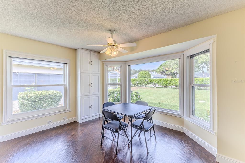 2181 Terrace View Lane Spring Hill, FL 34606 - Photo 23 of 60 a view of a dining room with furniture window and wooden floor