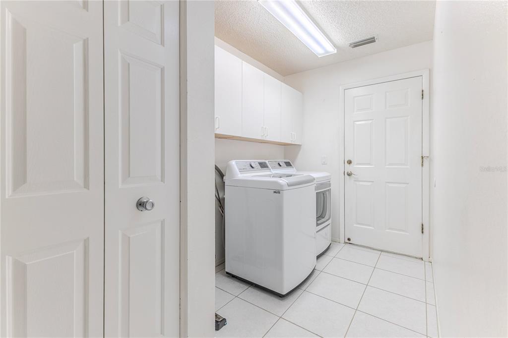 2181 Terrace View Lane Spring Hill, FL 34606 - Photo 24 of 60 a utility room with dryer and washer
