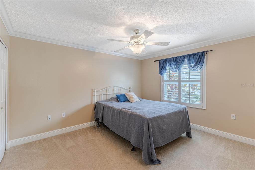2181 Terrace View Lane Spring Hill, FL 34606 - Photo 25 of 60 a bedroom with a bed and a window