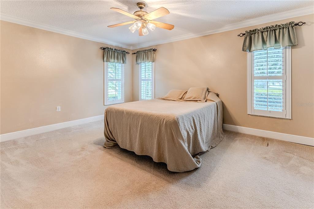 2181 Terrace View Lane Spring Hill, FL 34606 - Photo 27 of 60 a bedroom with a bed and a window
