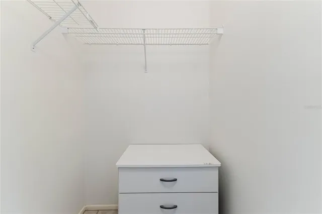 a bathroom with a granite countertop toilet sink and shower