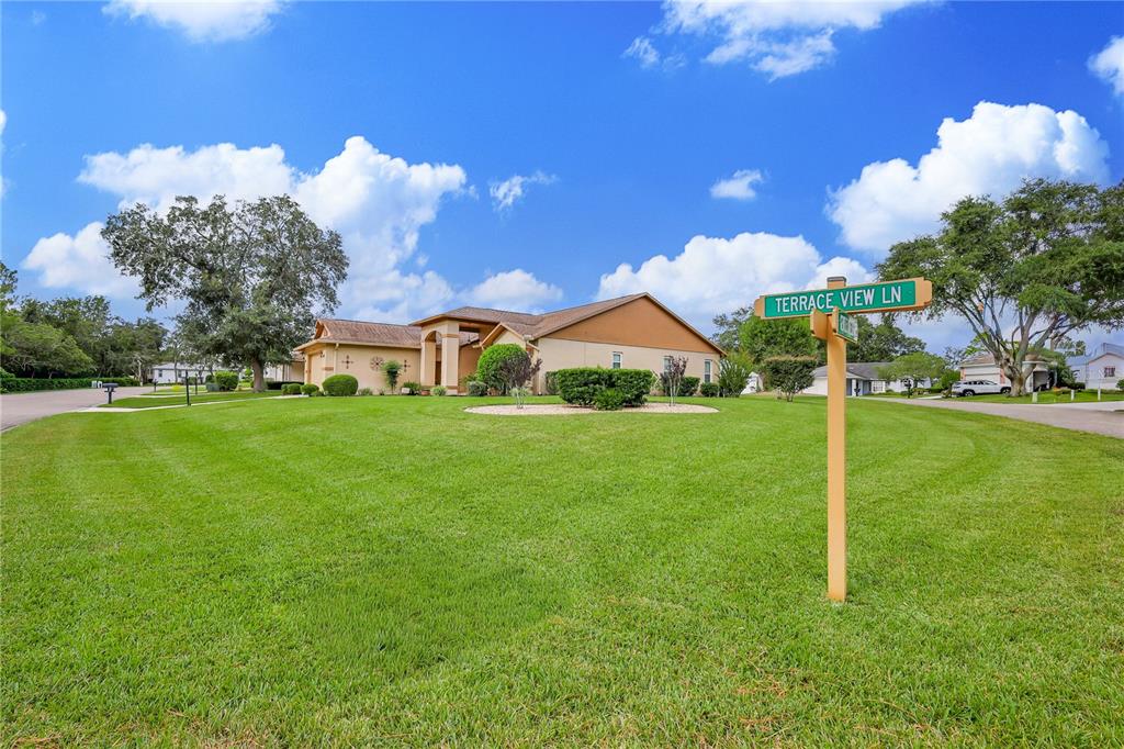 2181 Terrace View Lane Spring Hill, FL 34606 - Photo 3 of 60 a view of an house with backyard and a tree