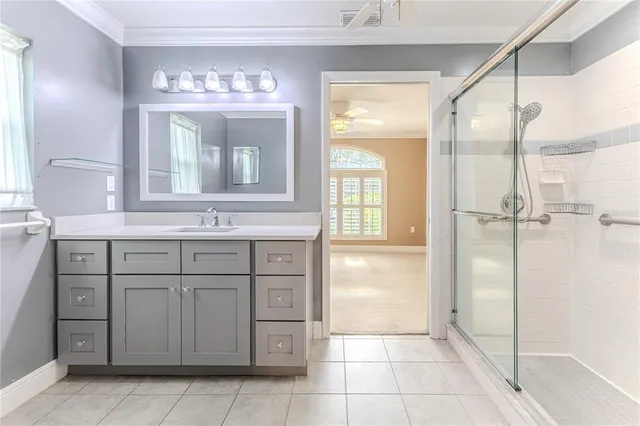 a view of a house with a big yard and potted plants