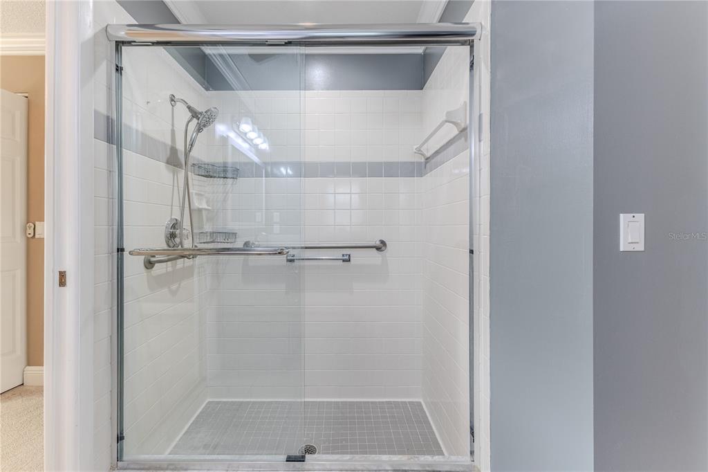 2181 Terrace View Lane Spring Hill, FL 34606 - Photo 38 of 60 a bathroom with a glass shower door