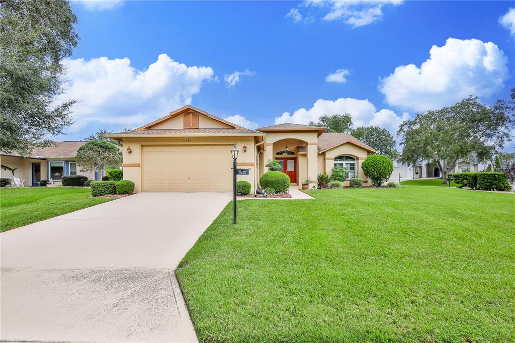 2181 Terrace View Lane Spring Hill, FL 34606 - Photo 48 of 60 a front view of a house with garden