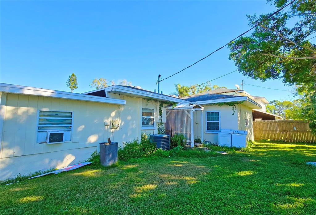 3310 Lexington Street Sarasota, FL 34231 - Photo 18 of 35 a view of a house with a yard and plants