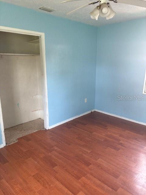 3310 Lexington Street Sarasota, FL 34231 - Photo 28 of 35 an empty room with a wooden floor