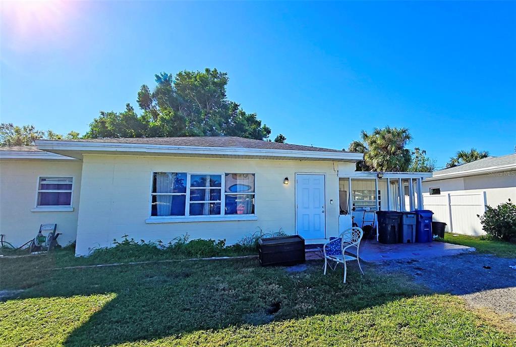 3310 Lexington Street Sarasota, FL 34231 - Photo 32 of 35 a view of a house with a porch and furniture