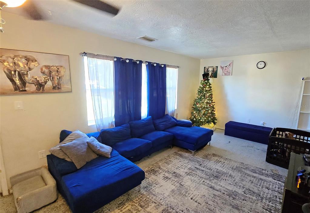 3310 Lexington Street Sarasota, FL 34231 - Photo 5 of 35 a living room with furniture and a window