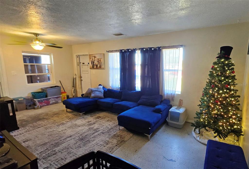 3310 Lexington Street Sarasota, FL 34231 - Photo 8 of 35 a living room with furniture and a window