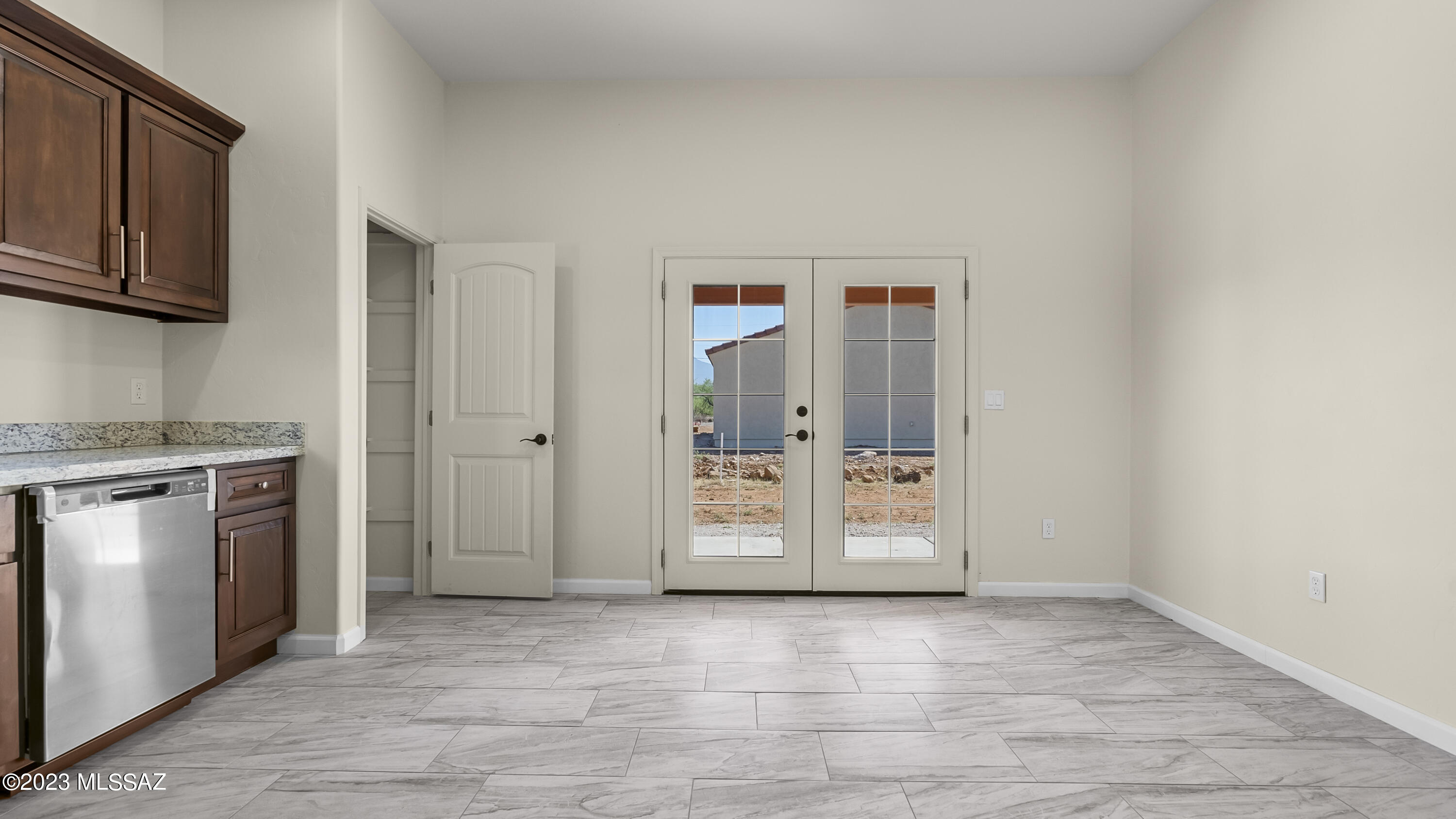 1799 Saltillo Court Rio Rico, AZ 85648 - Photo 8 of 25 a view of an empty room with window and cabinet