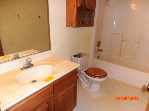 416 Fawn Lane Oswego, IL 60543 - Photo 14 of 15 a bathroom with a sink and a toilet
