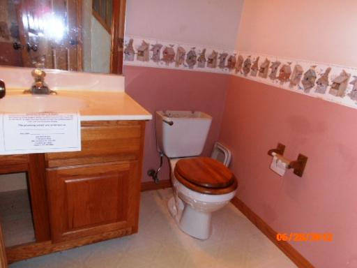 416 Fawn Lane Oswego, IL 60543 - Photo 6 of 15 a bathroom with a toilet and a sink