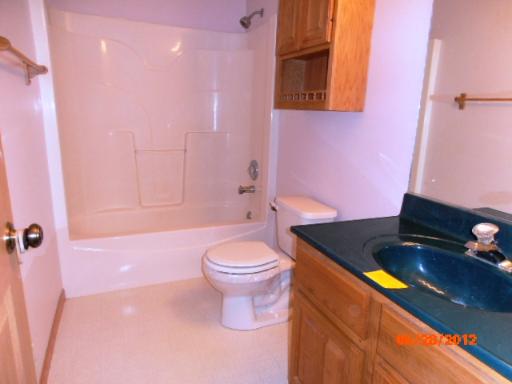 416 Fawn Lane Oswego, IL 60543 - Photo 9 of 15 a bathroom with a granite countertop bathtub sink and toilet