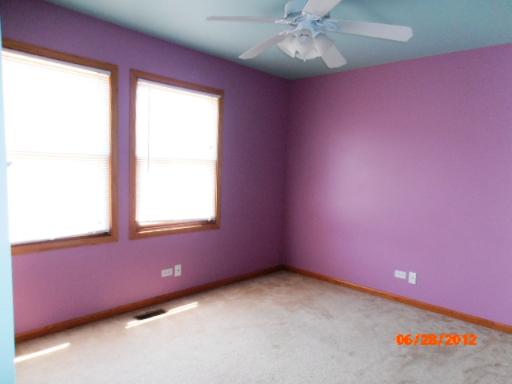416 Fawn Lane Oswego, IL 60543 - Photo 10 of 15 a view of an empty room with a window