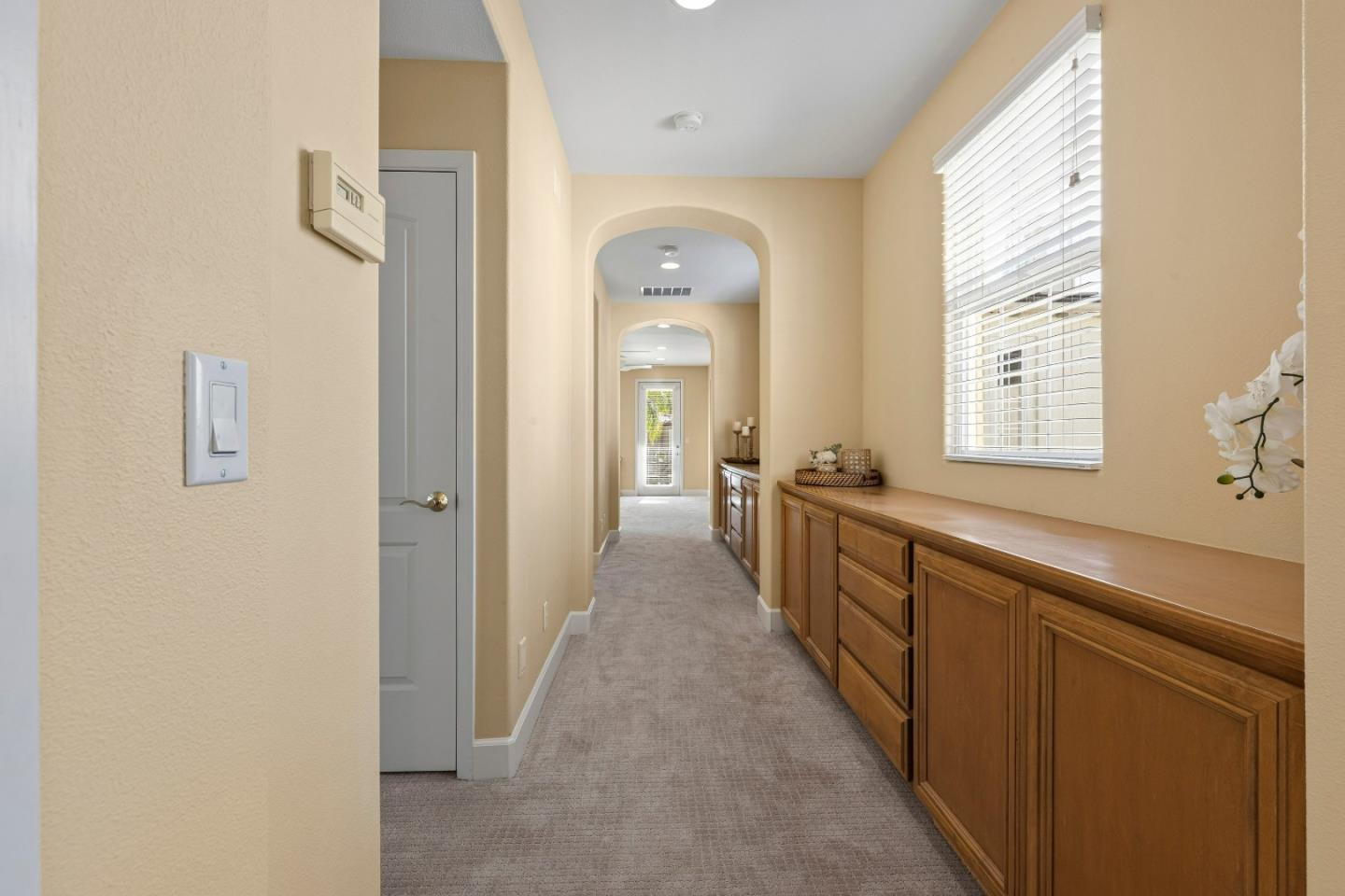 7466 Dunbar Court Gilroy, CA 95020 - Photo 65 of 103 a view of a hallway with windows