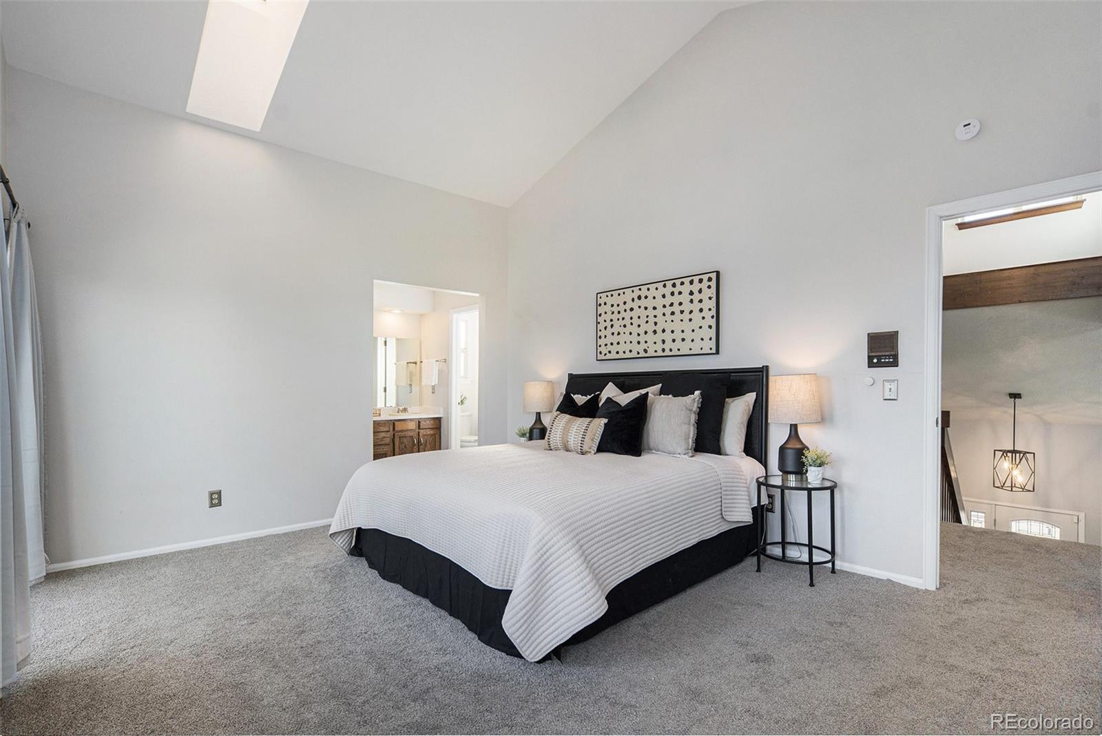 11820 Wyandot Circle Denver, CO 80234 - Photo 14 of 35 a large bedroom with a bed and window