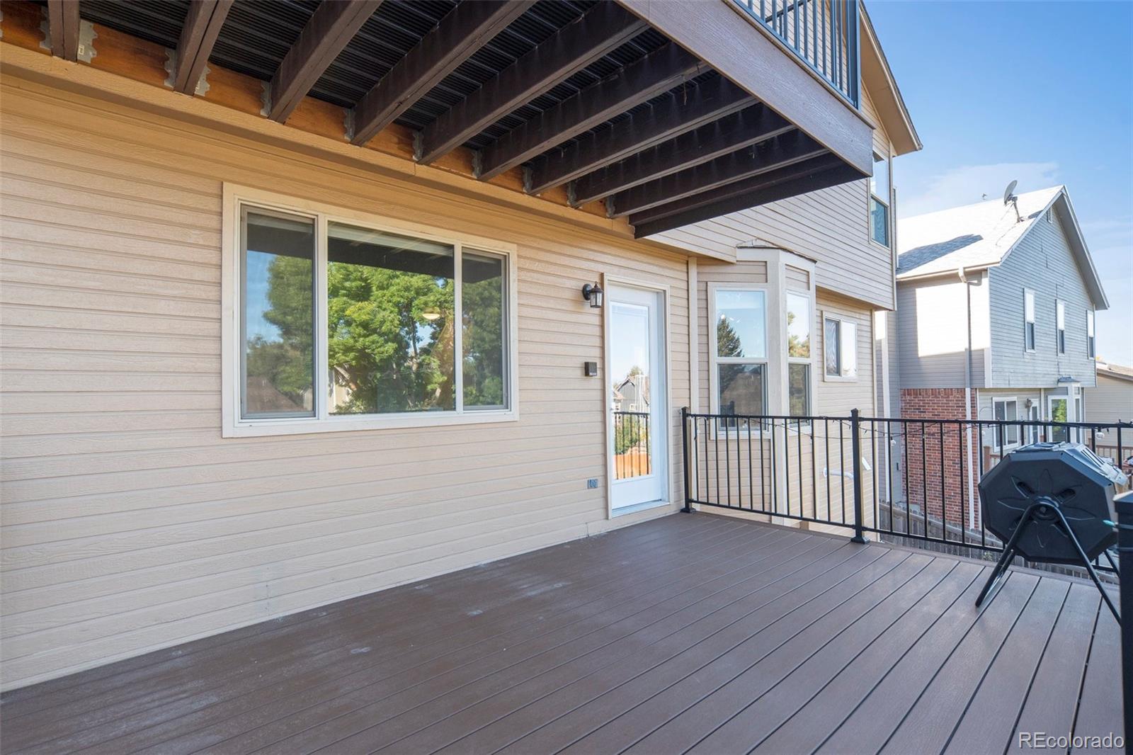 11820 Wyandot Circle Denver, CO 80234 - Photo 29 of 35 a view of backyard with deck and wooden floor