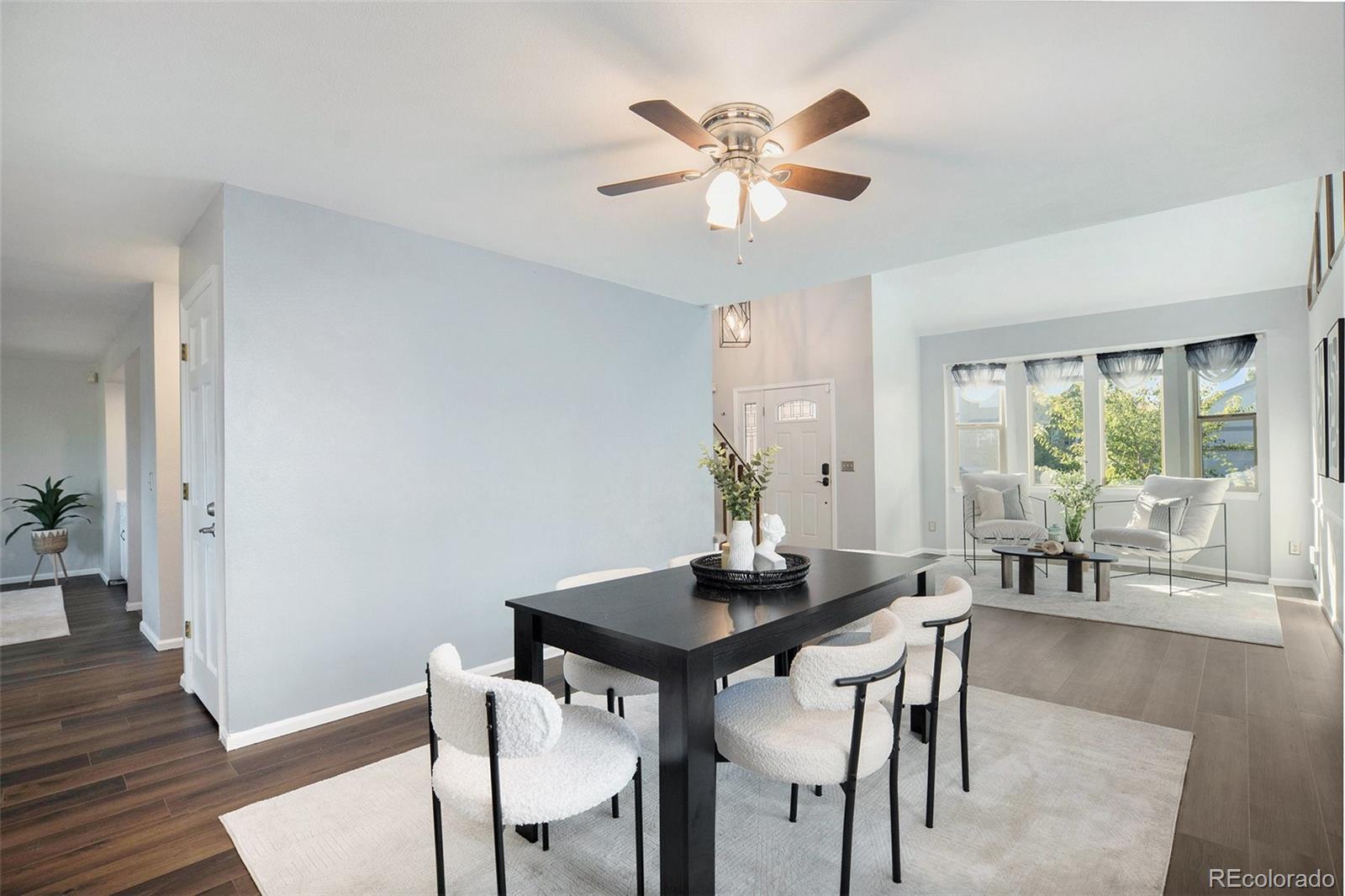 11820 Wyandot Circle Denver, CO 80234 - Photo 6 of 35 a view of a dining room with furniture and wooden floor