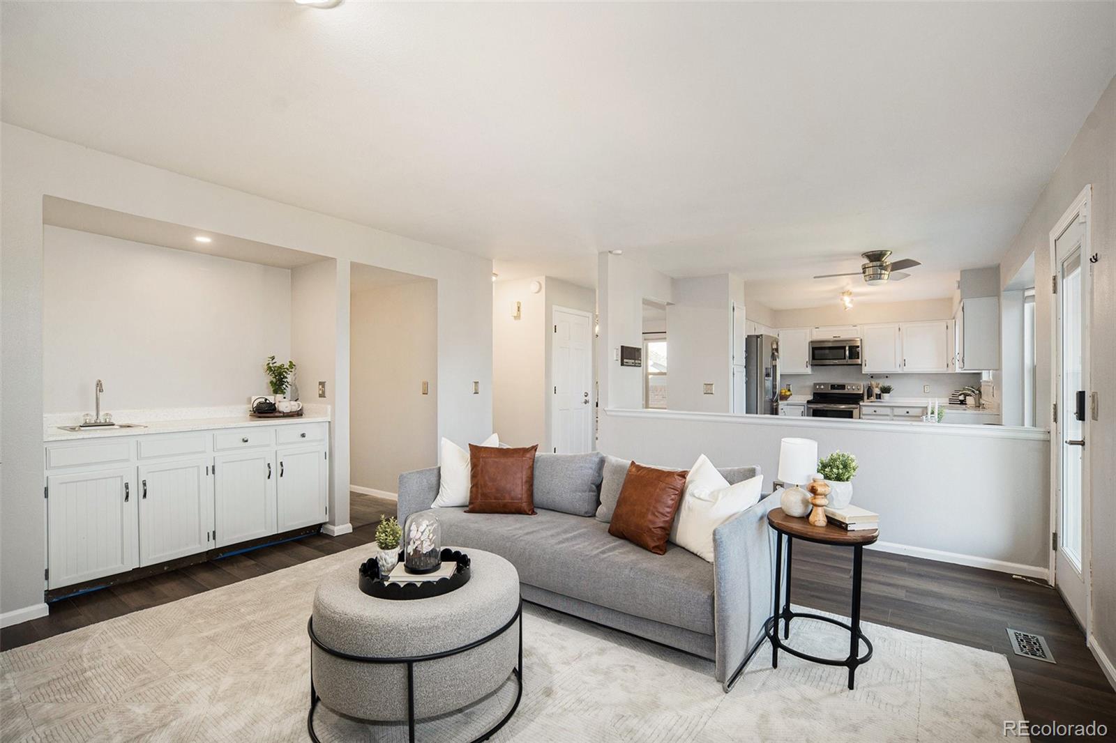 11820 Wyandot Circle Denver, CO 80234 - Photo 9 of 35 a living room with furniture and a potted plant