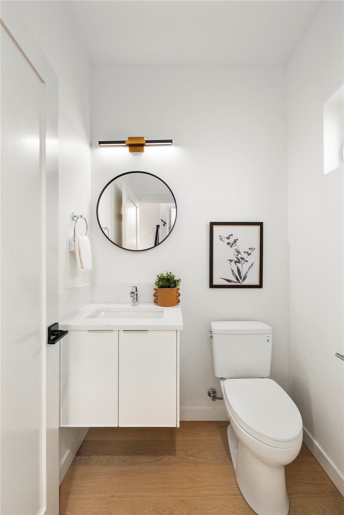 4121 B Chilberg Avenue Southwest Seattle, WA 98116 - Photo 12 of 29 a bathroom with a toilet sink vanity and mirror