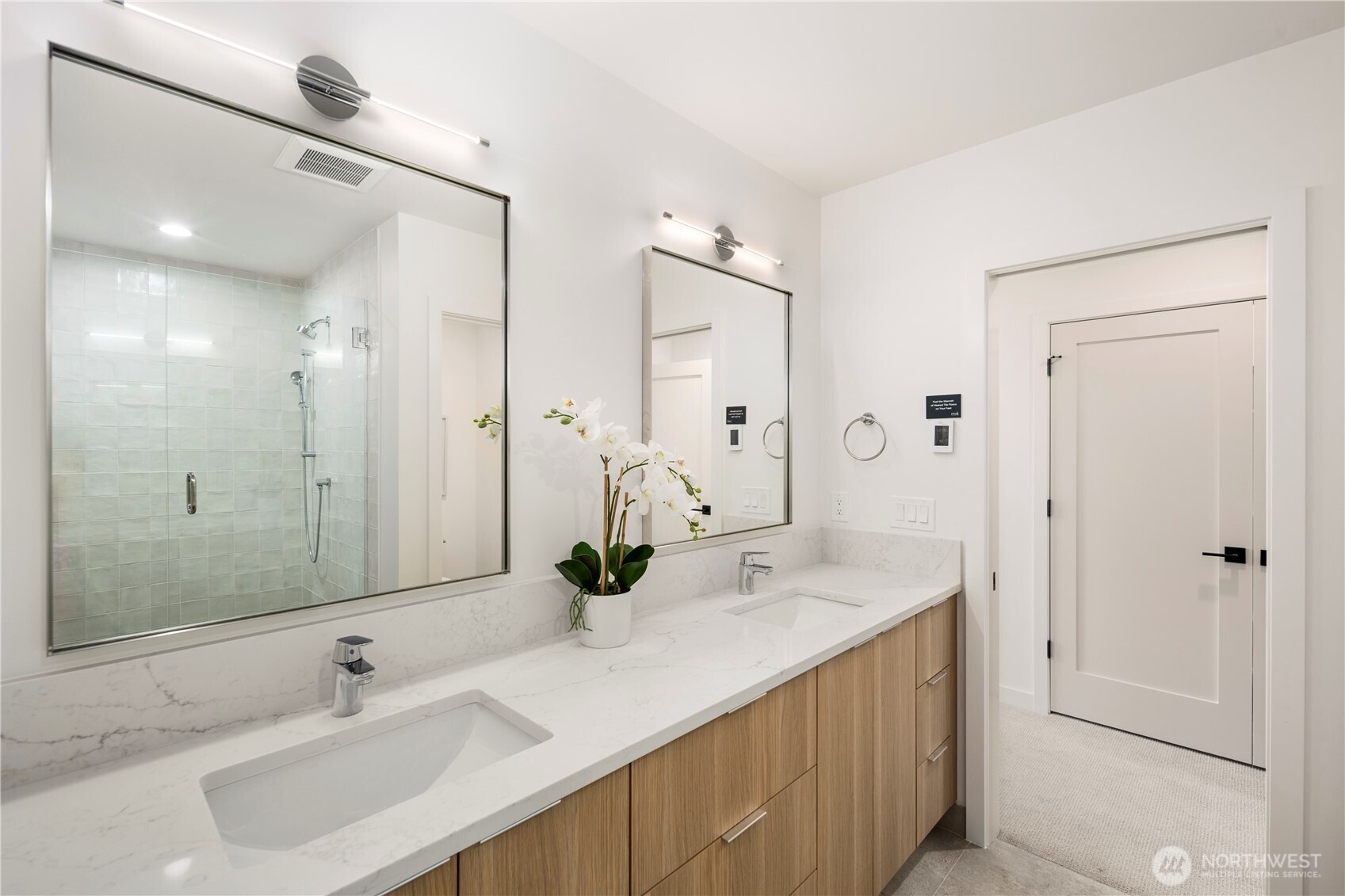 4121 B Chilberg Avenue Southwest Seattle, WA 98116 - Photo 16 of 29 a bathroom with a sink double vanity and a mirror