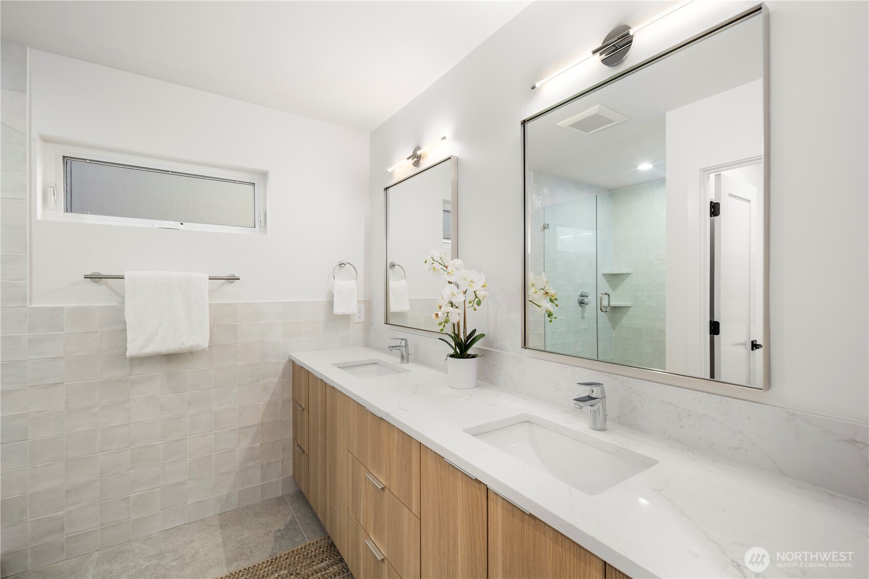 4121 B Chilberg Avenue Southwest Seattle, WA 98116 - Photo 17 of 29 a bathroom with a double vanity sink mirror and double